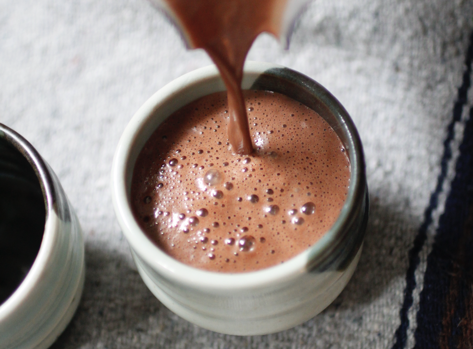 Cacao being poured into a cup
